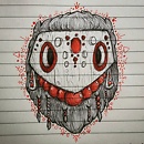 wooden mask with with red bead necklace and red patterns drawing